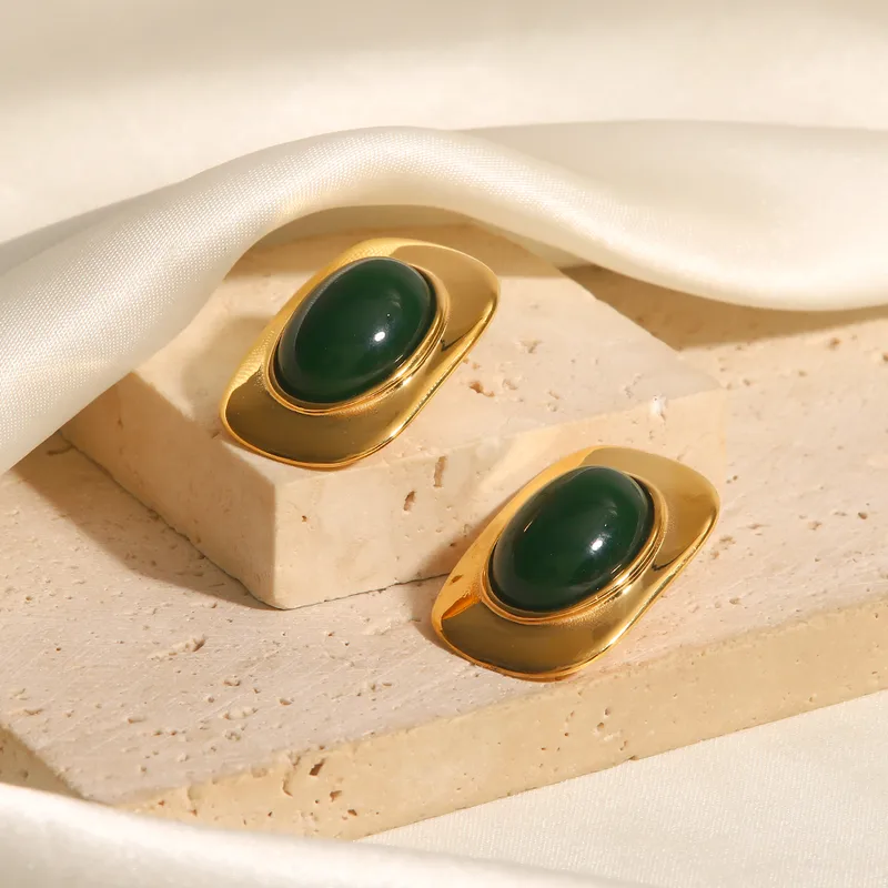 Antique gold finish green stone earrings styled for festive and saree wear - waterproof and anti-tarnish